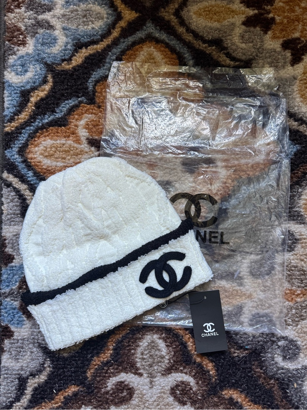CHANEL White Tweed Hat with Black Logo Trim